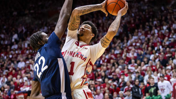 Indiana Hoosiers center Kel'el Ware (1) shoots the ball while Penn State Nittany Lions forward Qudus Wahab (22) defends in the first half at Simon Skjodt Assembly Hall.  