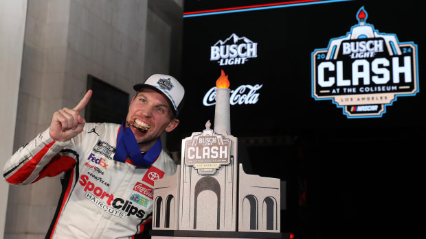 Denny Hamlin celebrates in victory lane after winning Saturday night's Busch Light Clash at Los Angeles Memorial Coliseum. (Photo by Meg Oliphant/Getty Images)
