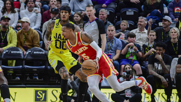 Feb 3, 2023; Salt Lake City, Utah, USA; Atlanta Hawks guard Dejounte Murray (5) dribbles around Utah Jazz guard Jordan Clarkson (00) during the second half at Vivint Arena.