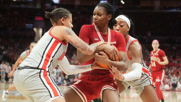 Feb 4, 2024; Columbus, OH, USA; Indiana Hoosiers guard Chloe Moore-McNeil (22) defends the ball against Ohio State Buckeyes guard Rikki Harris (1) and Ohio State Buckeyes guard Jacy Sheldon (4) during the second half at Value City Arena.