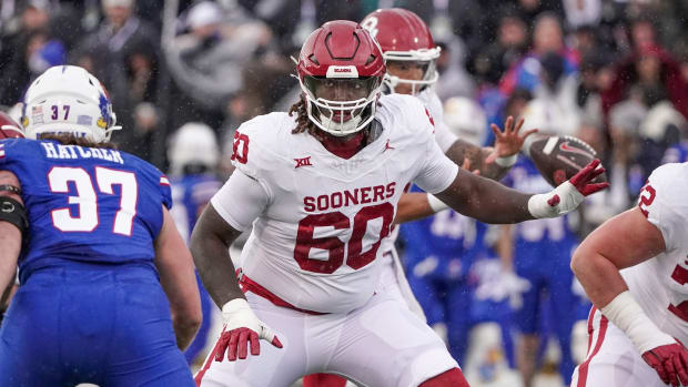 Oct 28, 2023; Lawrence, Kansas, USA; Oklahoma Sooners offensive lineman Tyler Guyton (60) at the line of scrimmage against the Kansas Jayhawks during the game at David Booth Kansas Memorial Stadium. Mandatory Credit: Denny Medley-USA TODAY Sports  