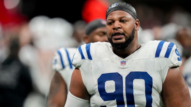 Indianapolis Colts defensive tackle Grover Stewart (90) walks the sideline Sunday, Dec. 24, 2023, during a game against the Atlanta Falcons at Mercedes-Benz Stadium in Atlanta.