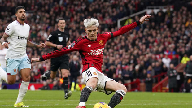 Alejandro Garnacho pictured shooting to score his second goal of the game in Manchester United's 3-0 win over West Ham in February 2024