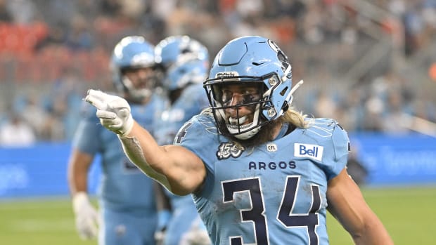 Jun 18, 2023; Toronto, Ontario, CAN; Toronto Argonauts running back AJ Ouellette (34) gestures after running for a first down against the Hamilton Tiger-Cats in the fourth quarter at BMO Field. Mandatory Credit: Dan Hamilton-USA TODAY Sports