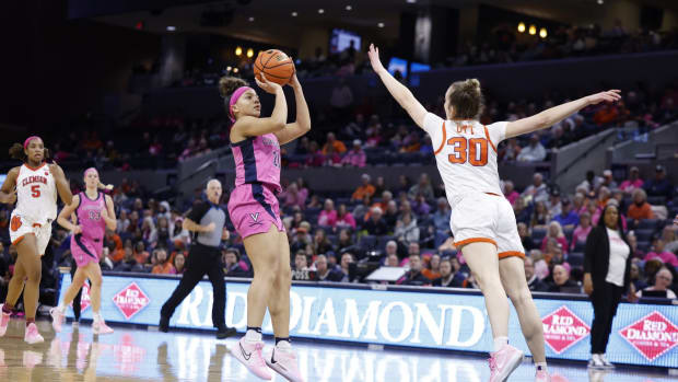 Kymora Johnson attempts a jump shot during the Virginia women's basketball game against Clemson at John Paul Jones Arena.