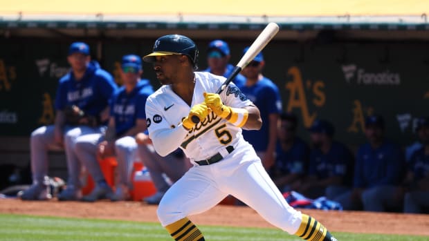Sep 4, 2023; Oakland, California, USA; Oakland Athletics left fielder Tony Kemp (5) earns a walk against the Toronto Blue Jays during the first inning at Oakland-Alameda County Coliseum. Mandatory Credit: Kelley L Cox-USA TODAY Sports  