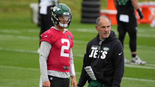New York Jets quarterback Zach Wilson (2) and offensive line coach John Benton during a practice.