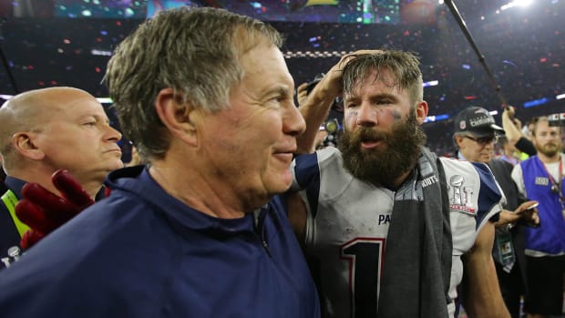 New England Patriots head coach Bill Belichick celebrates with wide receiver Julian Edelman (11) after defeating the Atlanta Falcons during Super Bowl LI at NRG Stadium.