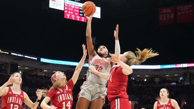 Feb 4, 2024; Columbus, OH, USA; Ohio State Buckeyes forward Cotie McMahon (32) shoots against Indiana Hoosiers guard Yarden Garzon (12), Indiana Hoosiers guard Sara Scalia (14) and Indiana Hoosiers guard Lenee Beaumont (5) at Value City Arena.