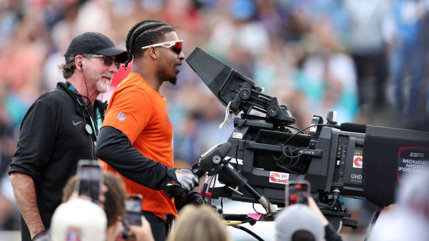 Feb 4, 2024; Orlando, FL, USA; AFC wide receiver Ja'Marr Chase of the Cincinnati Bengals steps behind the camera during the 2024 Pro Bowl at Camping World Stadium. Mandatory Credit: Nathan Ray Seebeck-USA TODAY Sports  