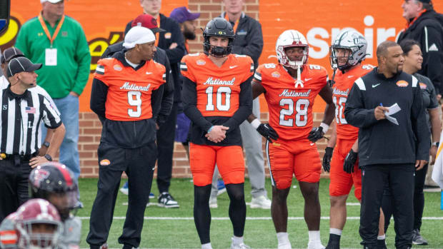 Former Washington QB Michael Penix Jr.(9) and former Oregon QB Bo Nix (10) watch the action from the sideline during the Reese's Senior Bowl in Mobile, Alabama on Saturday, Feb. 3, 2024.  