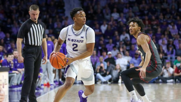 Jan 30, 2024; Manhattan, Kansas, USA; Kansas State Wildcats guard Tylor Perry (2) is guarded by Oklahoma Sooners guard Milos Uzan (12) during the first half at Bramlage Coliseum. Mandatory Credit: Scott Sewell-USA TODAY Sports  