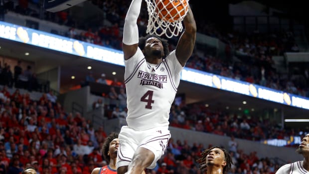 Mississippi State Bulldogs forward Cameron Matthews (4) dunks during the first half against the Mississippi Rebels at The Sandy and John Black Pavilion at Ole Miss.