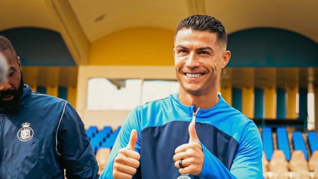Cristiano Ronaldo pictured giving a double thumbs up gesture to the camera while posing for a photograph during an Al Nassr training session on his 39th birthday in February 2024