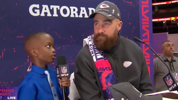11-year-old reporter Jeremiah Fennell interviews Travis Kelce at opening night of Super Bowl LVIII in Las Vegas.