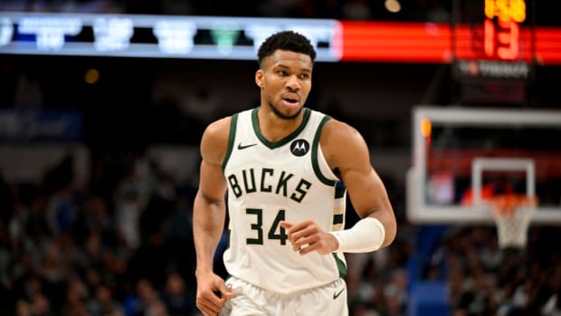 Milwaukee Bucks forward Giannis Antetokounmpo (34) runs back up the court during the second half against the Dallas Mavericks at the American Airlines Center.