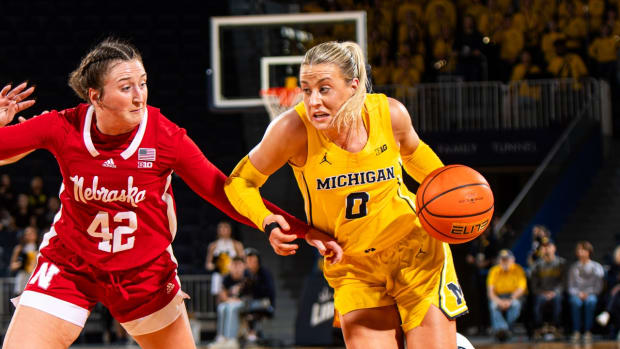 Nebraska's Maddie Krull defends as Michigan's Elissa Brett handles the ball Tuesday night in Ann Arbor, Michigan.