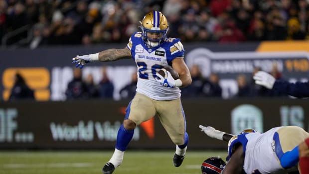 Nov 19, 2023; Hamilton, Ontario, CAN; Winnipeg Blue Bombers running back Brady Oliveira (20) runs against the Montreal Alouettes during the first quarter of the 110th Grey Cup game at Tim Hortons Field. Mandatory Credit: John E. Sokolowski-USA TODAY Sports  