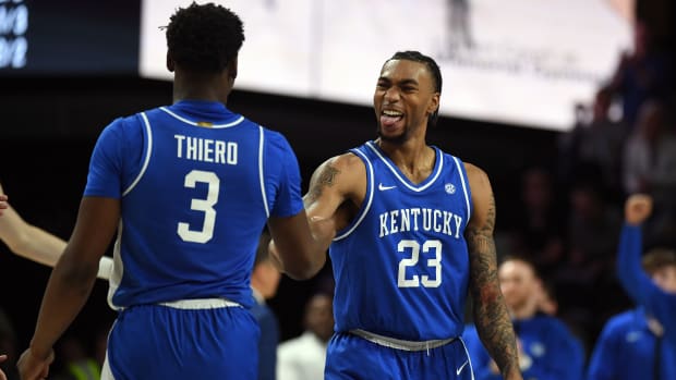 Feb 6, 2024; Nashville, Tennessee, USA; Kentucky Wildcats guard Jordan Burks (23) celebrates with guard Adou Thiero (3) after a basket during the second half against the Vanderbilt Commodores at Memorial Gymnasium. Mandatory Credit: Christopher Hanewinckel-USA TODAY Sports