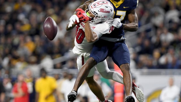 Dec 2, 2023; Detroit, MI, USA; Toledo Rockets cornerback Quinyon Mitchell (27) breaks up a pass intended for Miami (OH) Redhawks wide receiver Gage Larvadain (10) in the third quarter at Ford Field. Mandatory Credit: Lon Horwedel-USA TODAY Sports  