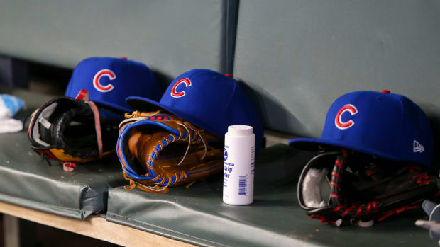 Apr 3, 2019; Atlanta, GA, USA; Detailed view of Chicago Cubs hats and gloves in the dugout against the Atlanta Braves in the fifth inning at SunTrust Park. Mandatory Credit: Brett Davis-USA TODAY Sports