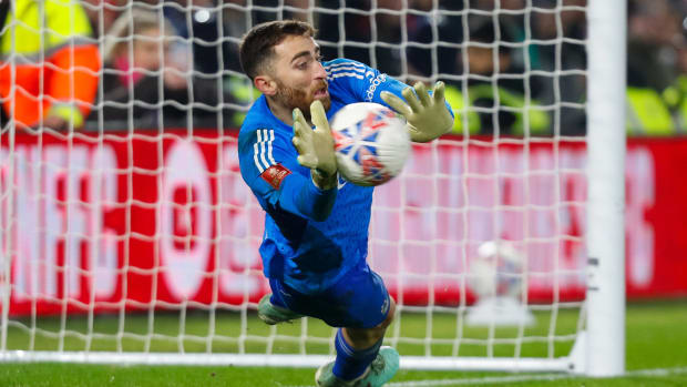 Nottingham Forest keeper Matt Turner pictured saving a penalty kick in an FA Cup shootout against Bristol City in February 2024