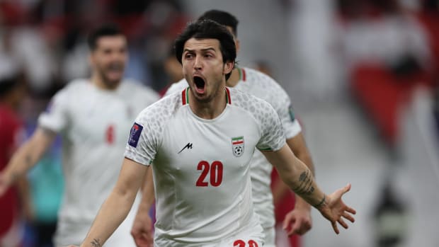 Sardar Azmoun pictured celebrating after scoring for Iran against Qatar in the semi-finals of the 2023 AFC Asian Cup