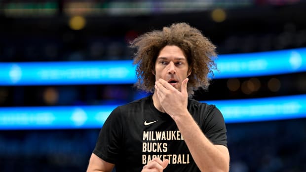 Feb 3, 2024; Dallas, Texas, USA; Milwaukee Bucks center Robin Lopez (42) warms up before the game between the Dallas Mavericks and the Milwaukee Bucks at the American Airlines Center. Mandatory Credit: Jerome Miron-USA TODAY Sports  