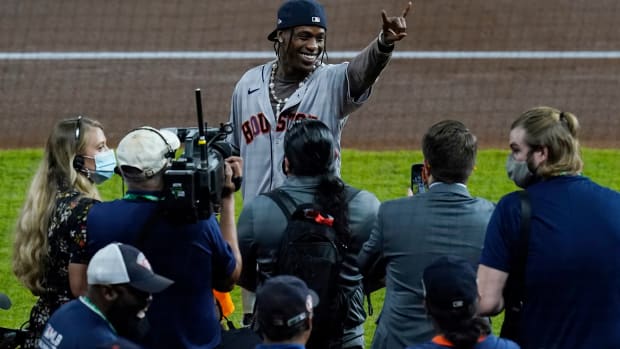 Nov 2, 2021; Houston, TX, USA; Recording artist Travis Scott gestures to the crowd before game six of the 2021 World Series between the Houston Astros and the Atlanta Braves at Minute Maid Park. Mandatory Credit: Thomas Shea-USA TODAY Sports