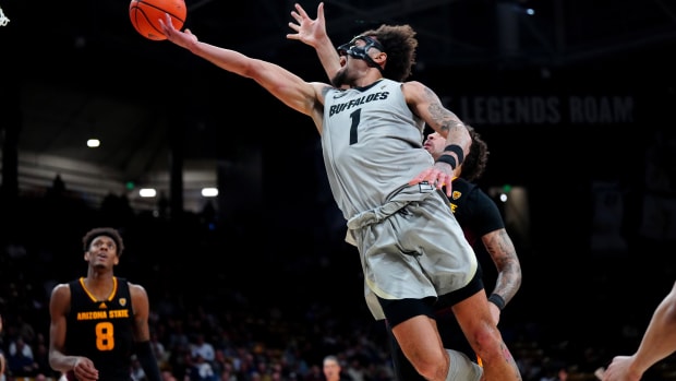 Feb 8, 2024; Boulder, Colorado, USA; Colorado Buffaloes guard J'Vonne Hadley (1) shoots the ball in the second half \V| at the CU Events Center.