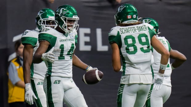 Aug 26, 2022; Vancouver, British Columbia, CAN; Saskatchewan Roughriders wide receiver Tevin Jones (14) celebrates his touchdown against the BC Lions in the second half at BC Place. Mandatory Credit: Bob Frid-USA TODAY Sports  