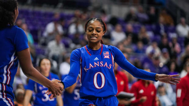 Kansas guard Wyvette Mayberry celebrates with teammates during  the game against TCU.