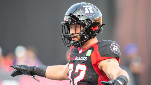 Jun 15, 2023; Ottawa, Ontario, CAN; Ottawa REDBLACKS lineback Adam Auclair (32) warms up prior to game against the Calgary Stampeders at TD Place. Mandatory Credit: Marc DesRosiers-USA TODAY Sports  