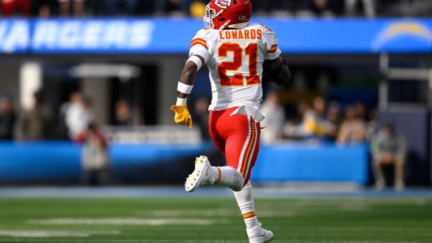 Jan 7, 2024; Inglewood, California, USA; Kansas City Chiefs safety Mike Edwards (21) returns a fumble for a touchdown during the first half against the Los Angeles Chargers at SoFi Stadium. Mandatory Credit: Orlando Ramirez-USA TODAY Sports