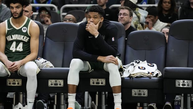 Milwaukee Bucks forward Giannis Antetokounmpo (34) looks on from the bench during the fourth quarter against the Minnesota Timberwolves 