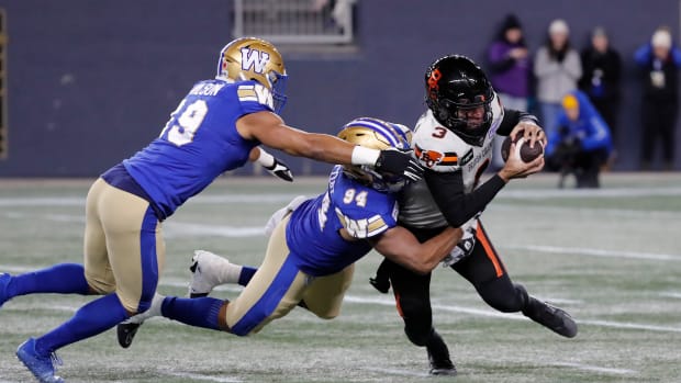 Nov 11, 2023; Winnipeg, Manitoba, CAN; BC Lions quarterback Vernon Adams Jr. (3) is tackled from behind by Winnipeg Blue Bombers defensive end Jackson Jeffcoat (94) during the first half of the game at IG Field. Mandatory Credit: Bruce Fedyck-USA TODAY Sports  