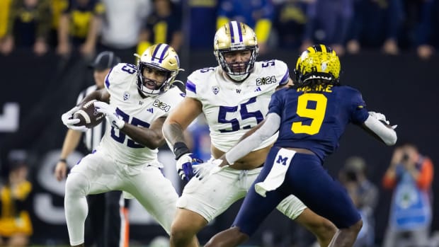Jan 8, 2024; Houston, TX, USA; Washington Huskies offensive lineman Troy Fautanu (55) blocks for tight end Devin Culp (83) against the Michigan Wolverines during the 2024 College Football Playoff national championship game at NRG Stadium. Mandatory Credit: Mark J. Rebilas-USA TODAY Sports  