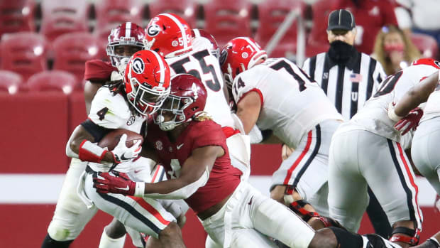 Alabama linebacker Christopher Allen (4) tackles Georgia running back James Cook (4) for a loss during Alabama's 41-24 win over Georgia in Bryant-Denny Stadium Saturday, Oct. 17, 2020.