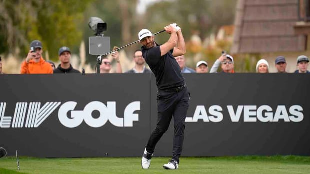 Dustin Johnson plays his shot from the 14th tee during the second round of the 2024 LIV Golf Las Vegas tournament at Las Vegas Country Club.