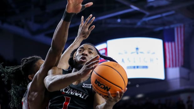 Feb 10, 2024; Cincinnati, Ohio, USA; Cincinnati Bearcats guard Day Day Thomas (1) shoots against the Houston Cougars in the second half at Fifth Third Arena. Mandatory Credit: Katie Stratman-USA TODAY Sports