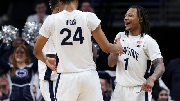 Penn State's Ace Baldwin Jr. (1) celebrates with teammate Zach Hicks during the Nittany Lions' Big Ten basketball win over Iowa at the Bryce Jordan Center.