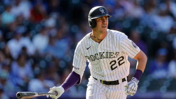 Sep 26, 2023; Denver, Colorado, USA; Colorado Rockies left fielder Nolan Jones (22) watches his ball on a solo home run in the seventh inning against the Los Angeles Dodgers at Coors Field.
