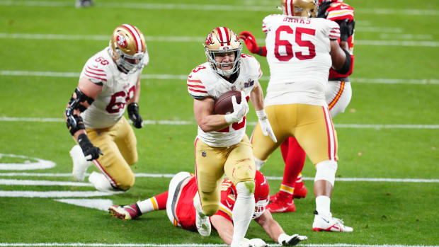 Feb 11, 2024; Paradise, Nevada, USA; San Francisco 49ers running back Christian McCaffrey (23) scores a touchdown against the Kansas City Chiefs in the first half in Super Bowl LVIII at Allegiant Stadium. Mandatory Credit: Stephen R. Sylvanie-USA TODAY Sports  
