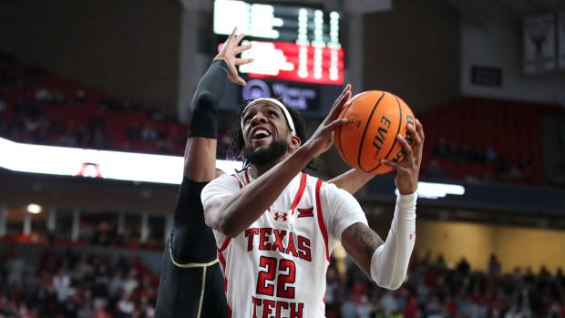 Feb 10, 2024; Lubbock, Texas, USA; Texas Tech Red Raiders forward Warren Washington (22) goes to the basket against Central Florida Knights forward Omar Payne (5) in the second half at United Supermarkets Arena. 