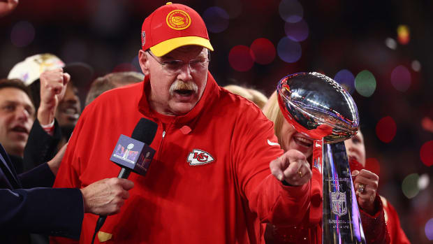 Chiefs coach Andy Reid celebrates with the Vince Lombardi Trophy.