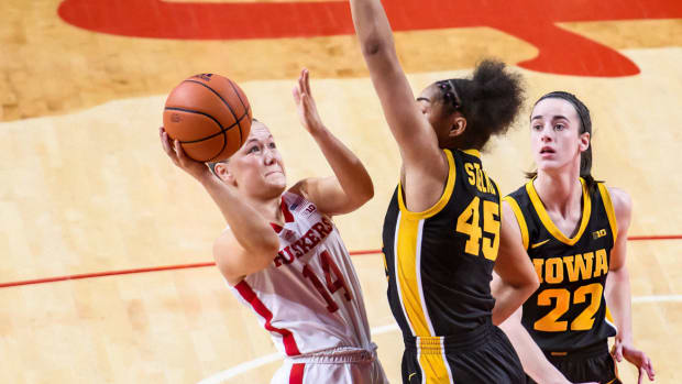 Nebraska's Callin Hake attempts a shot around Iowa's Hannah Stuelke during the Huskers' game Feb. 11 against the Hawkeyes at Pinnacle Bank Arena in Lincoln.