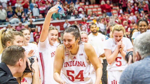 Indiana's Mackenzie Holmes (54) is splashed with water by teammates after the second half of the Indiana versus Purdue women's basketball game at Simon Skjodt Assembly Hall on Sunday, Feb. 11, 2024. Holmes become the all-time leading scorer in the school's history with her 17 points in the game.