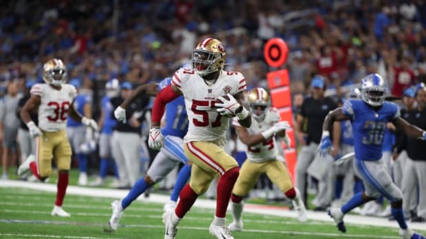 San Francisco 49ers linebacker Dre Greenlaw returns an interception back for a touchdown against the Detroit Lions on Sunday, Sept. 12, 2021 at Ford Field.