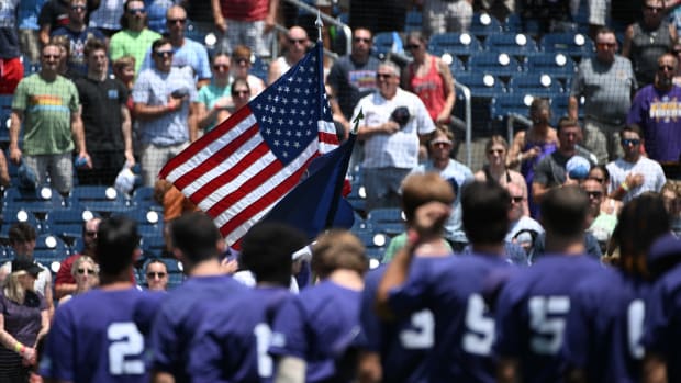 Jun 18, 2023; Omaha, NE, USA; The TCU Horned Frogs stand for the national anthem before the game against the Virginia Cavaliers at Charles Schwab Field Omaha. 