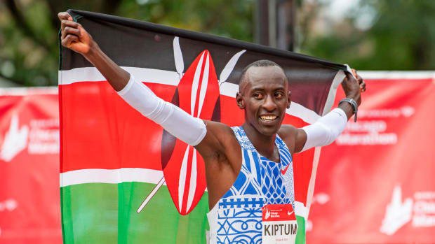 Kenyan Kelvin Kiptum celebrates winning the Chicago Marathon in Oct. 2023.
